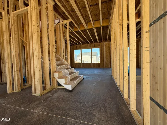 a view of entryway with a couch and door open