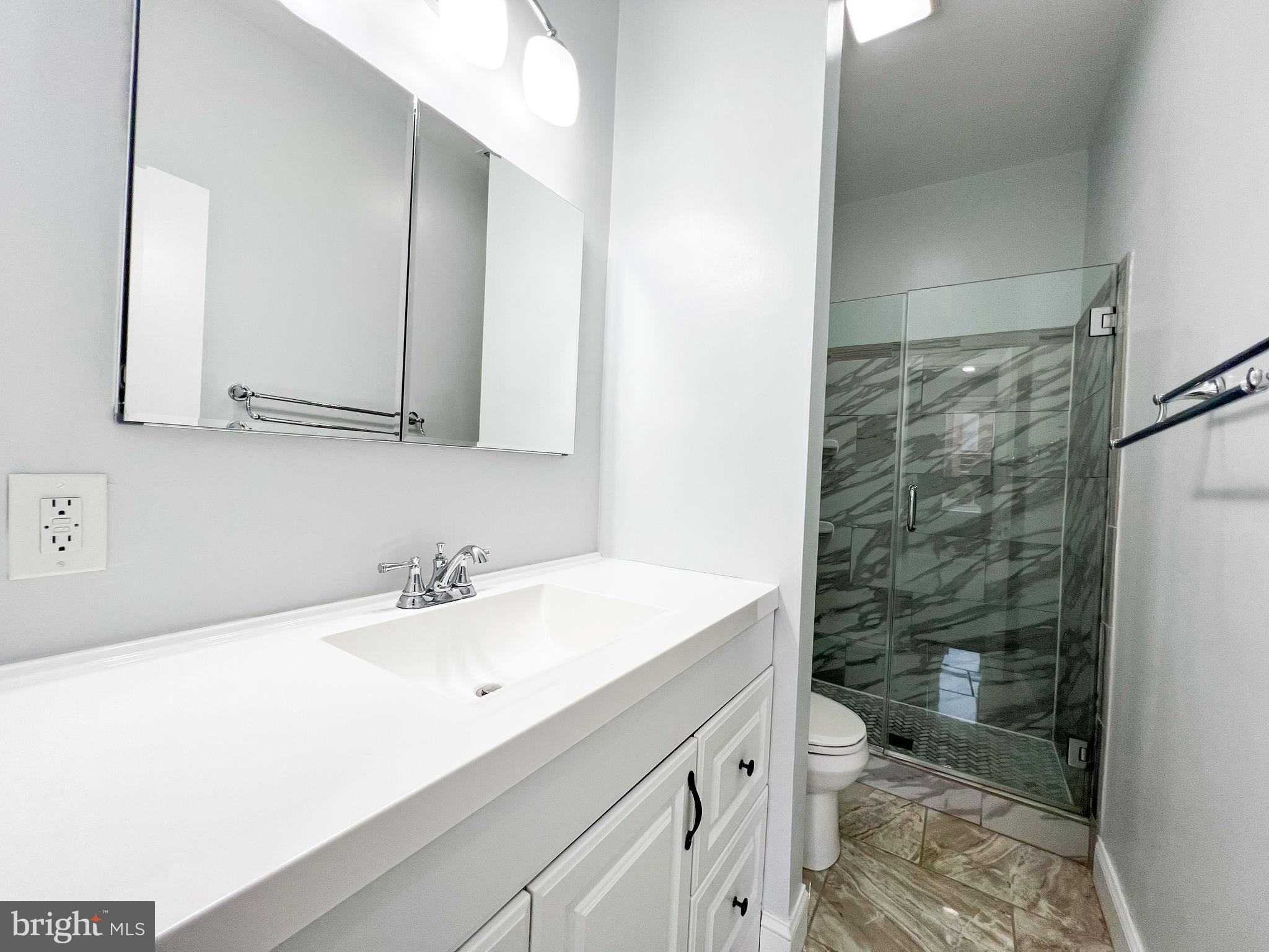 617 U Street Northwest Washington, DC 20001 - Photo 17 of 27 a bathroom with a sink a toilet and shower
