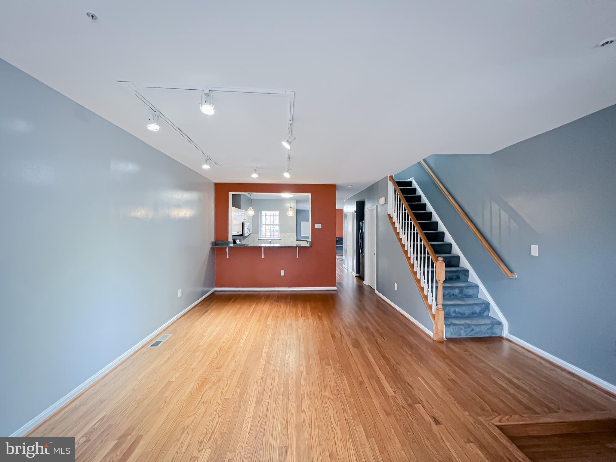 617 U Street Northwest Washington, DC 20001 - Photo 3 of 27 wooden floor in an empty room with a window