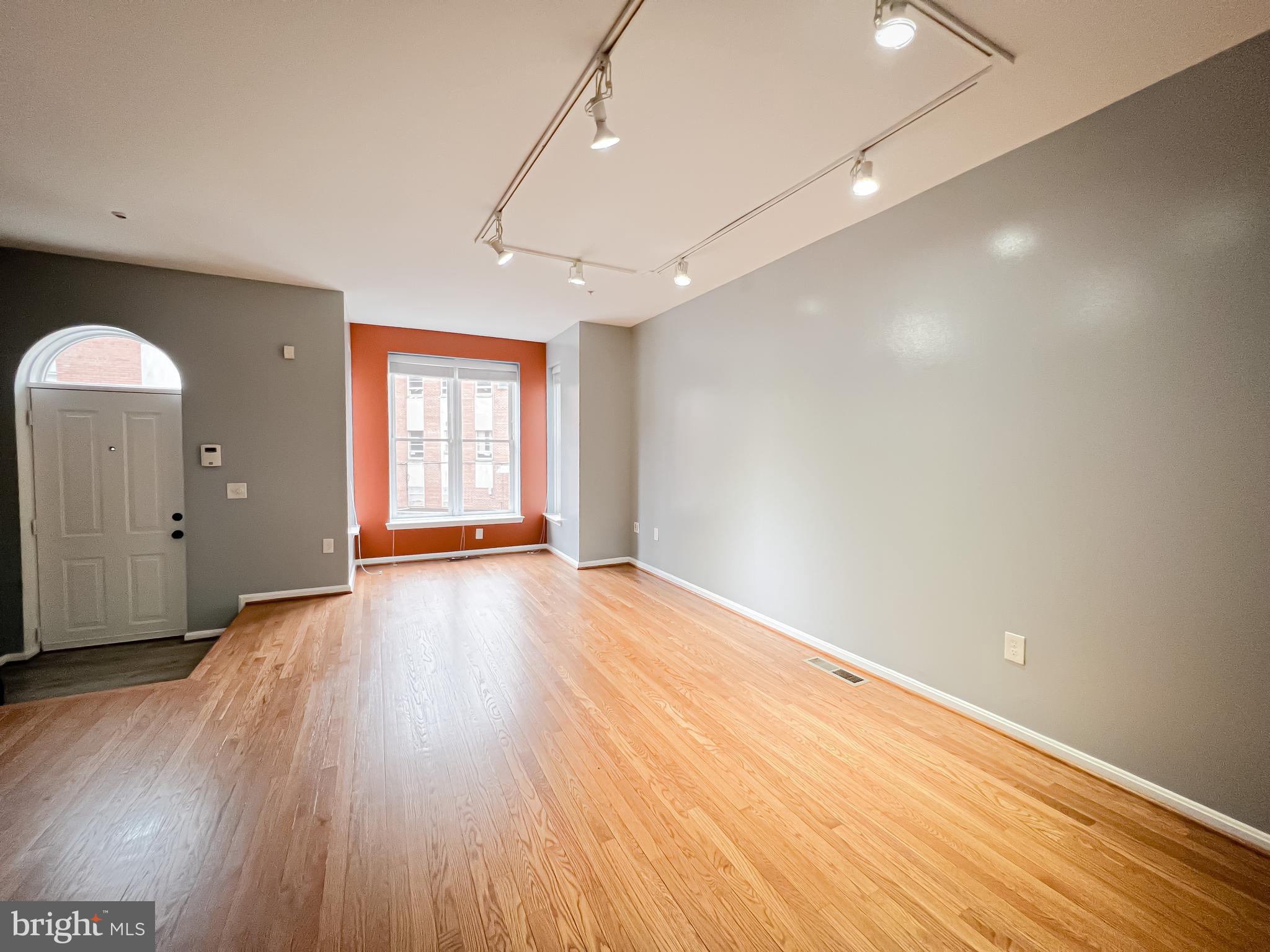 617 U Street Northwest Washington, DC 20001 - Photo 4 of 27 a view of empty room with wooden floor and fan