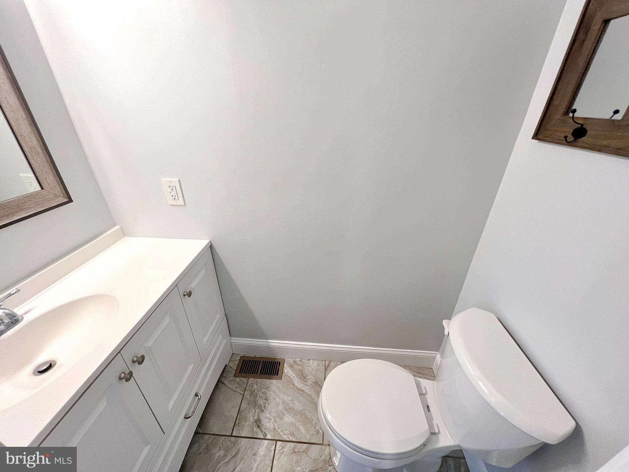 617 U Street Northwest Washington, DC 20001 - Photo 10 of 27 a bathroom with a sink a toilet and mirror