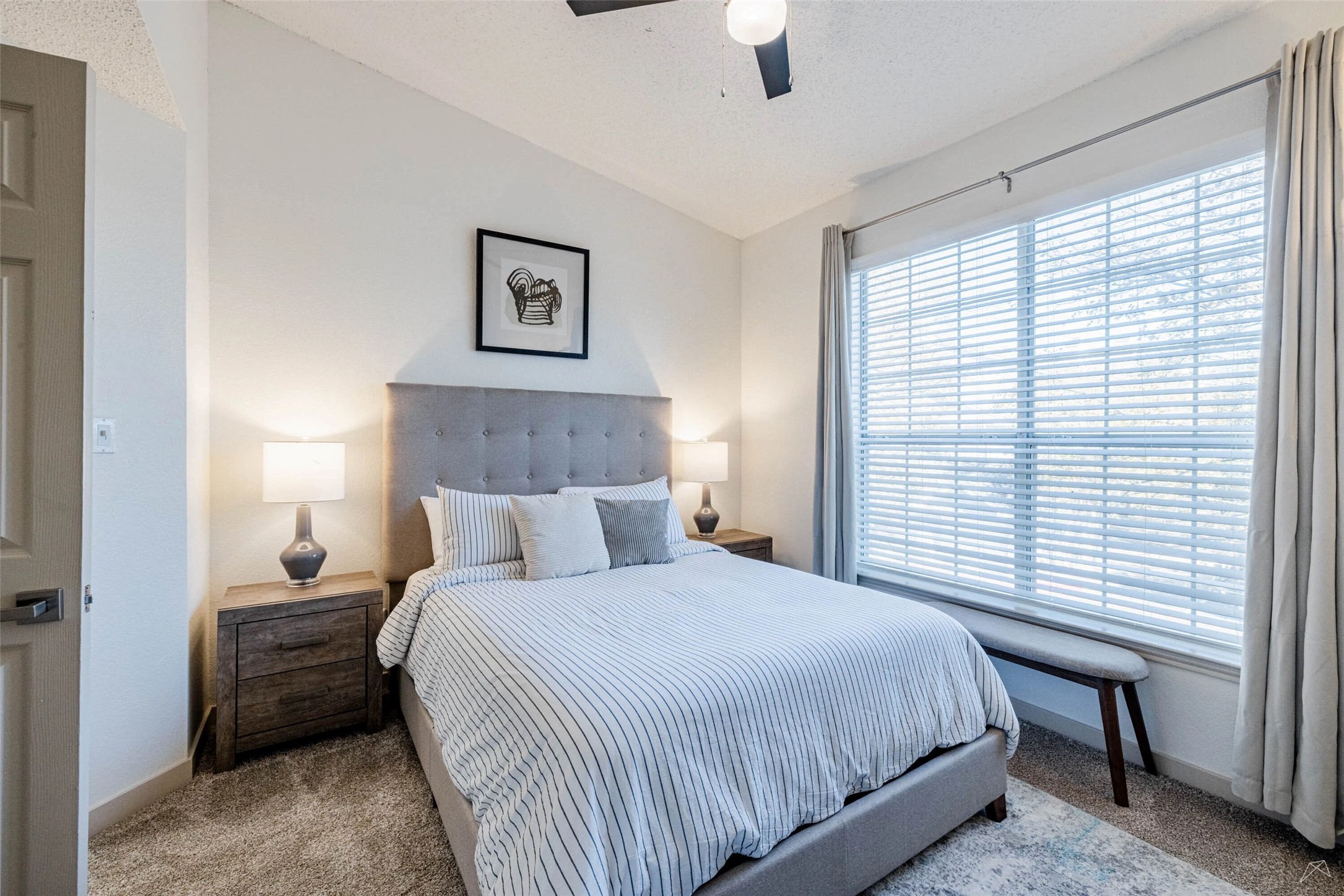 11908 Anderson Mill Road, Unit 822 Austin, TX 78726 - Photo 18 of 23 Carpeted bedroom with vaulted ceiling and ceiling fan