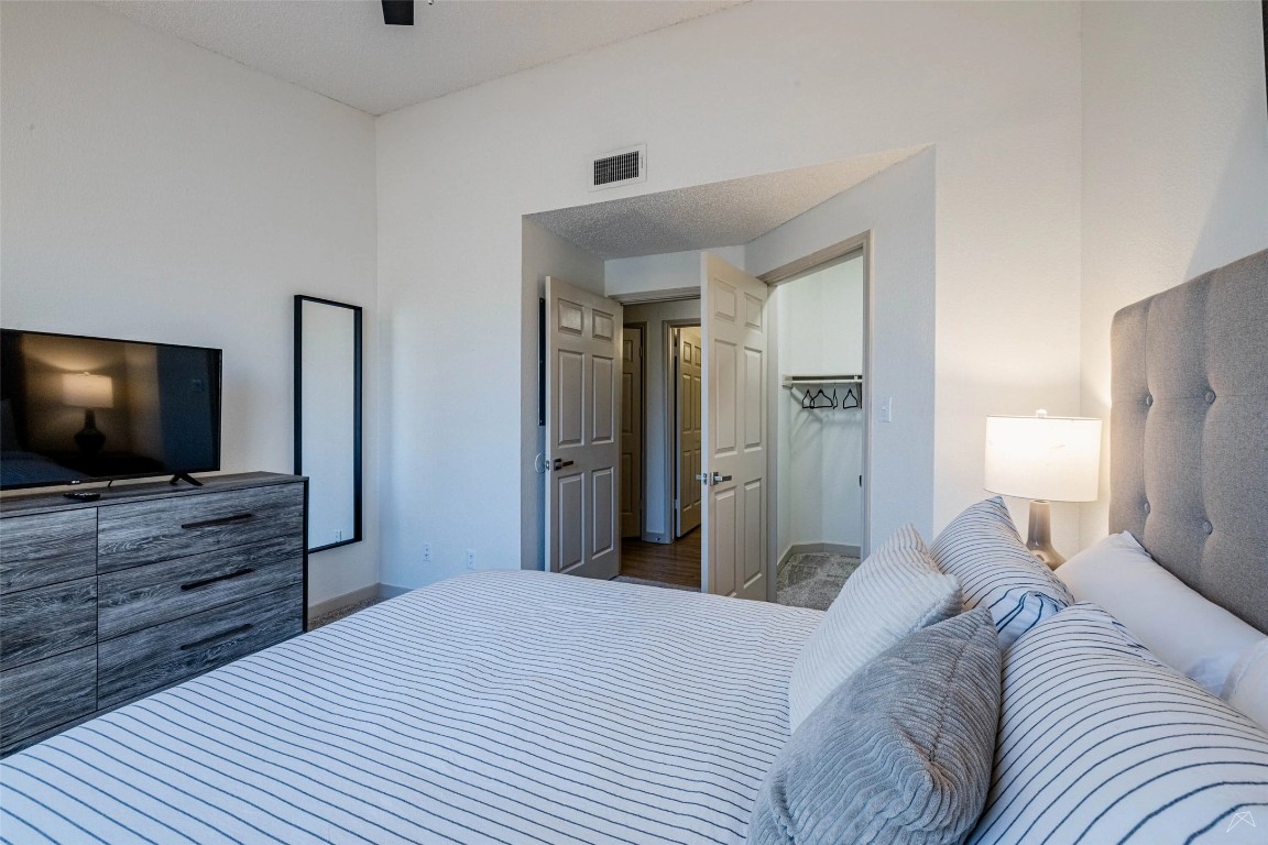 11908 Anderson Mill Road, Unit 822 Austin, TX 78726 - Photo 19 of 23 Bedroom with ceiling fan