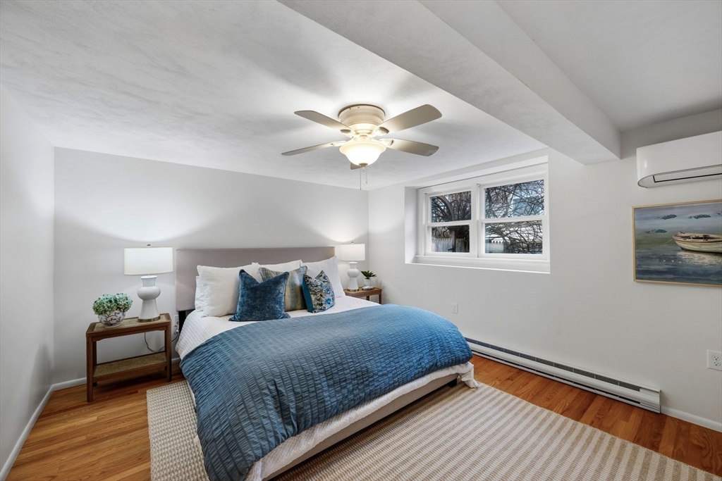 78 Bayview Road Marblehead, MA 01945 - Photo 19 of 30 a bedroom with a bed and a window