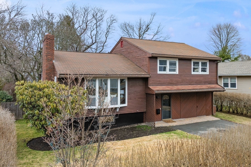 78 Bayview Road Marblehead, MA 01945 - Photo 2 of 30 a front view of a house with a garden and porch