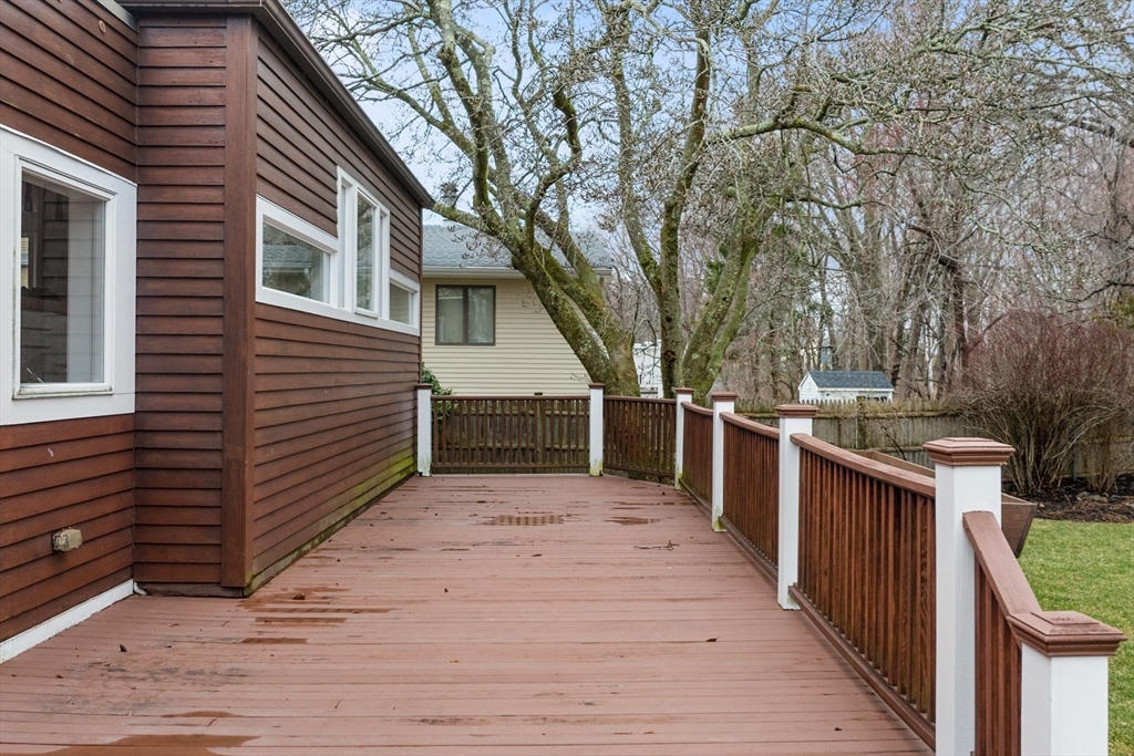 78 Bayview Road Marblehead, MA 01945 - Photo 27 of 30 a view of a house with wooden deck and trees