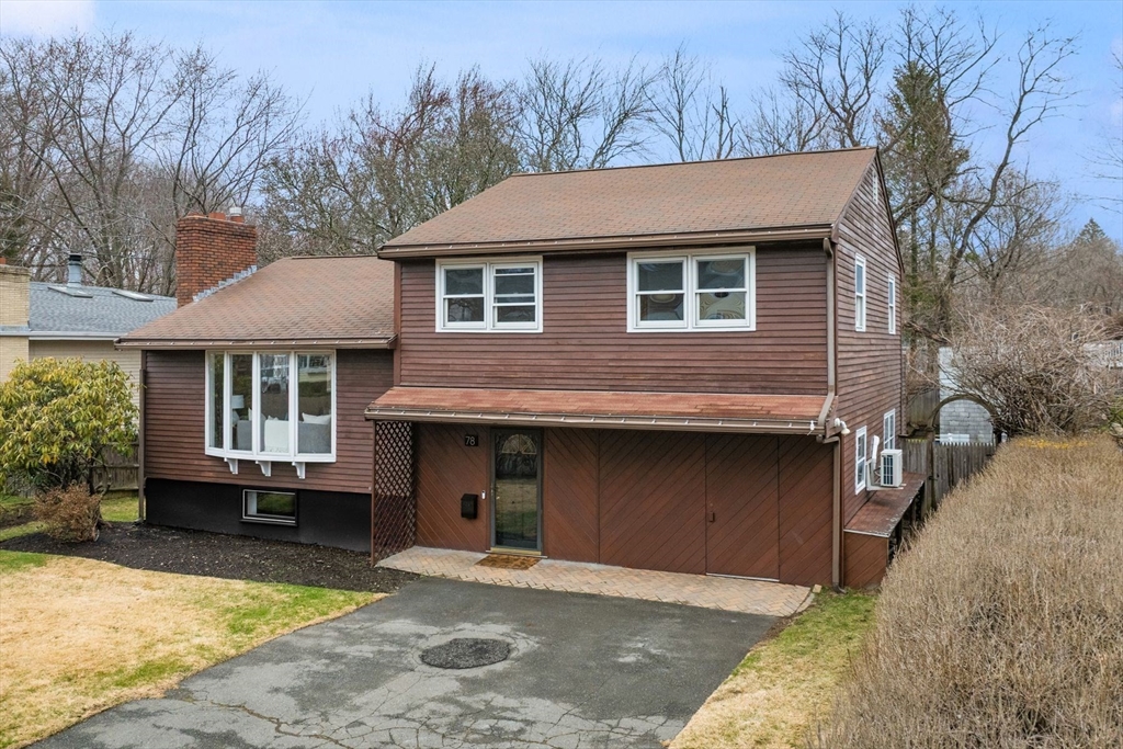 78 Bayview Road Marblehead, MA 01945 - Photo 30 of 30 a front view of a house with a yard and garage