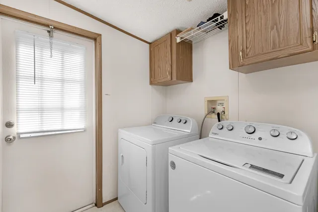 a bedroom with a bed window and walk in closet