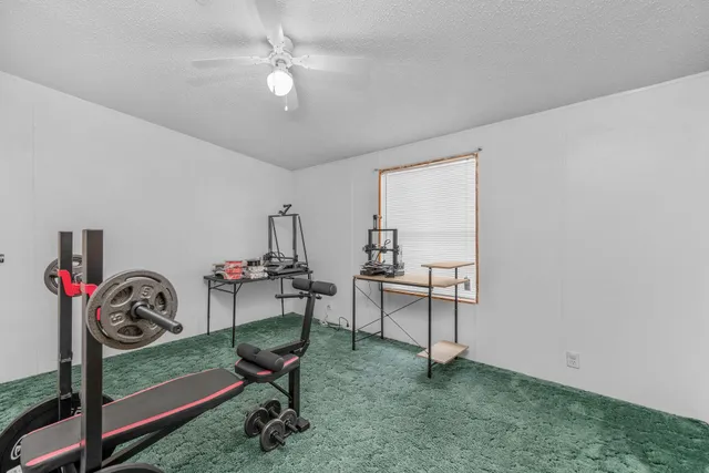 a bathroom with a shower a toilet and a sink