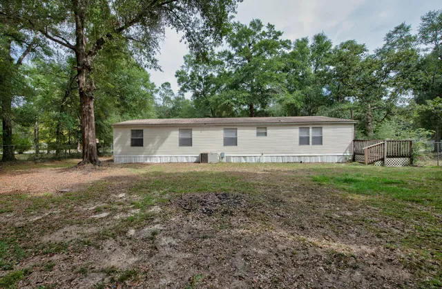 a backyard of a house with lots of green space