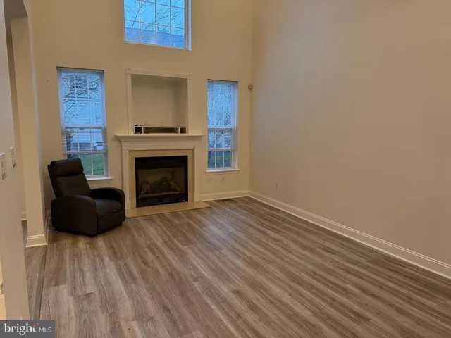 a view of a livingroom with furniture and a fireplace