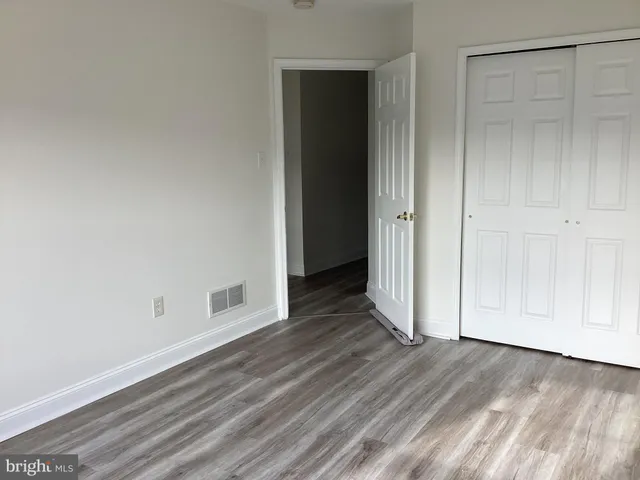 a view of a livingroom with wooden floor