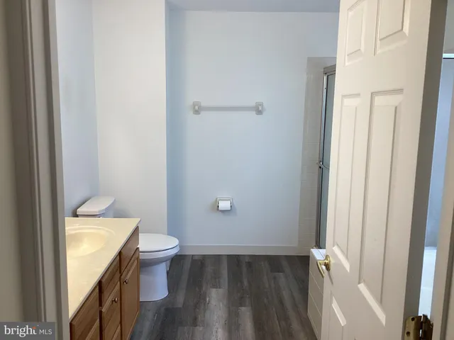 a bathroom with a granite countertop sink