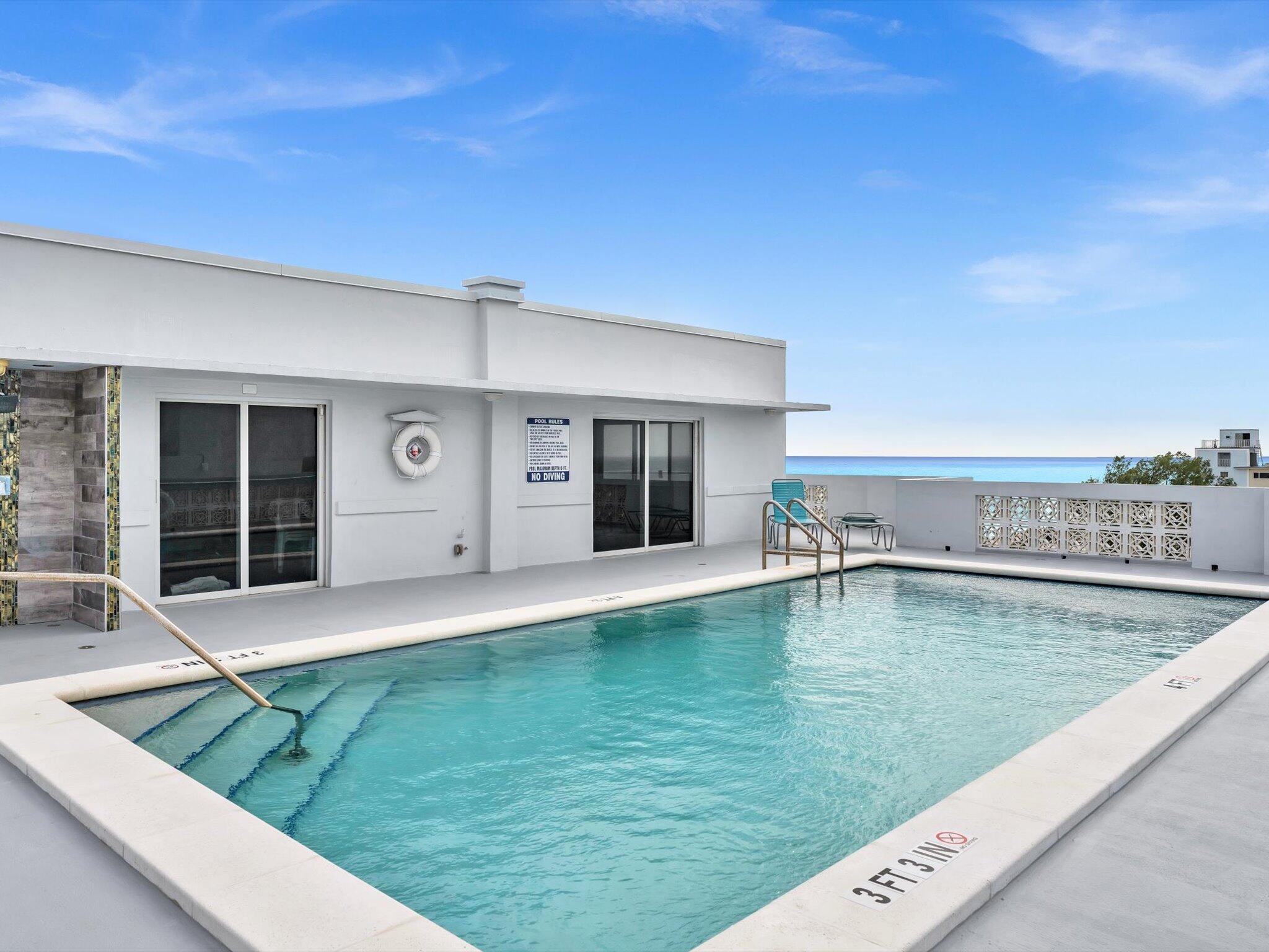 320 South Surf Road, Unit 205 Hollywood, FL 33019 - Photo 16 of 18 a view of a backyard with pool table and chairs