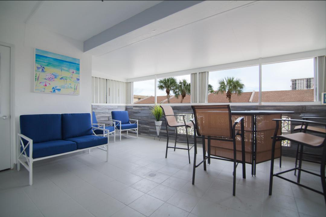 320 South Surf Road, Unit 205 Hollywood, FL 33019 - Photo 9 of 18 a view of a dining room with furniture and window
