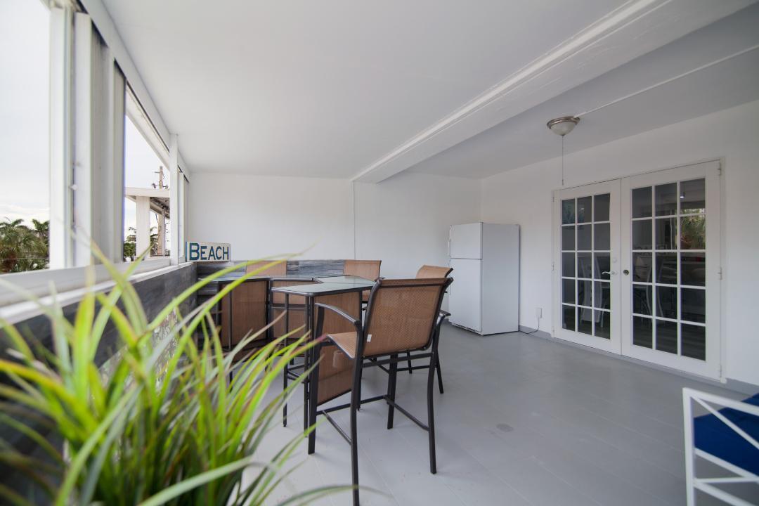 320 South Surf Road, Unit 205 Hollywood, FL 33019 - Photo 10 of 18 a view of a chairs and table in a patio