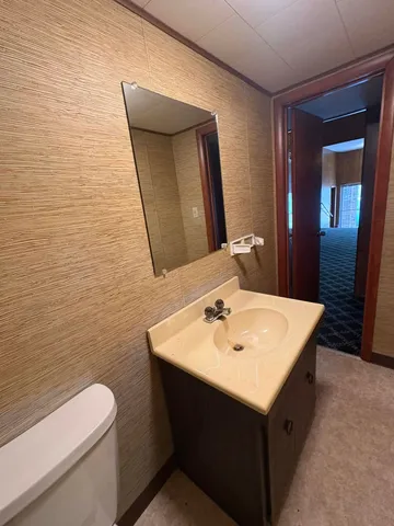 a kitchen with a sink and a stove with kitchen view