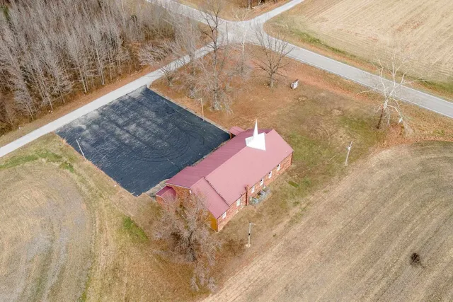 a bathroom with a shower and a door