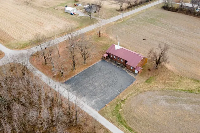 a view of a backyard with sitting area
