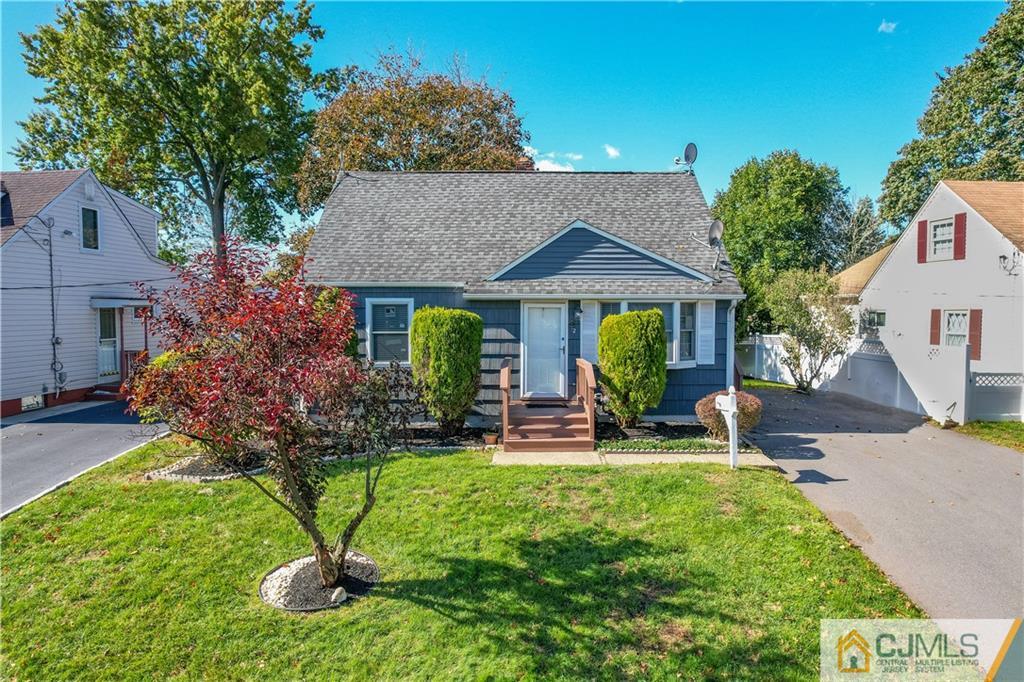 12 Jones Place Edison, NJ 08817 - Photo 1 of 28 a view of a house with backyard sitting area and garden