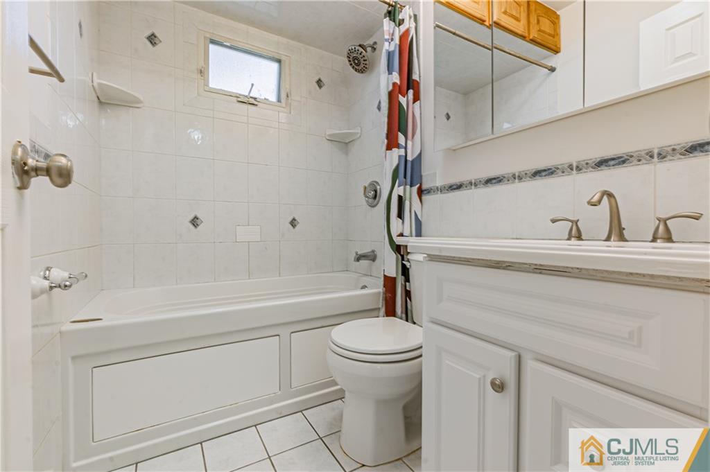 12 Jones Place Edison, NJ 08817 - Photo 21 of 28 a bathroom with a sink a toilet and a bathtub