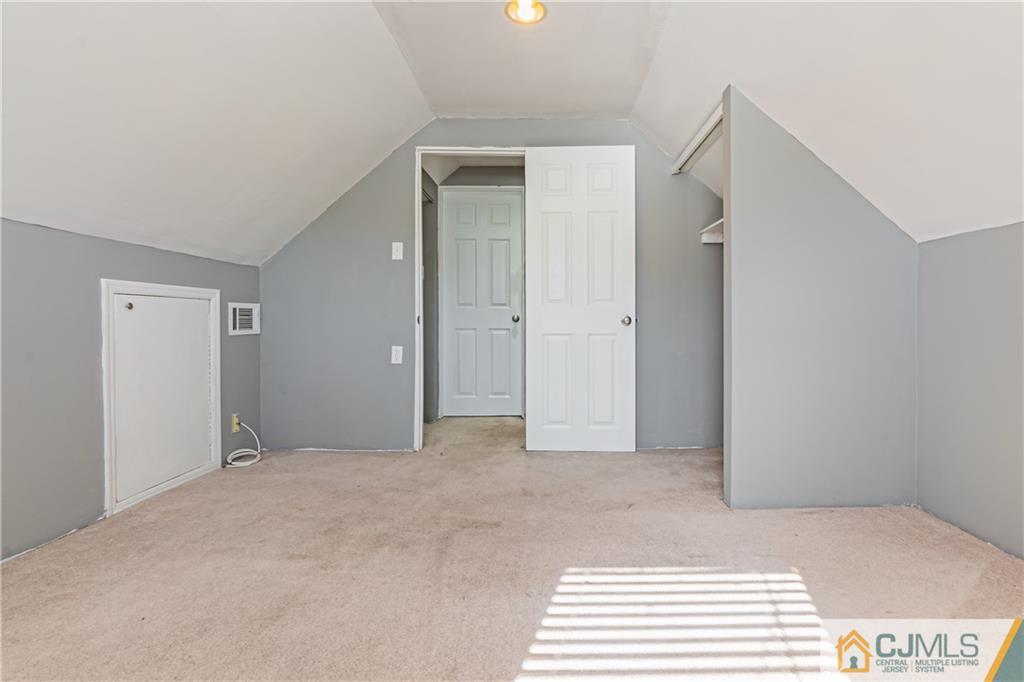 12 Jones Place Edison, NJ 08817 - Photo 25 of 28 a view of an empty room and window