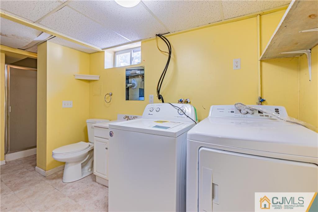 12 Jones Place Edison, NJ 08817 - Photo 26 of 28 a bathroom with a sink and a mirror