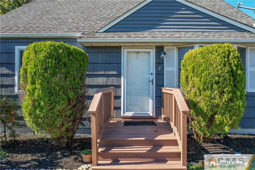 12 Jones Place Edison, NJ 08817 - Photo 3 of 28 a front view of a house with garden