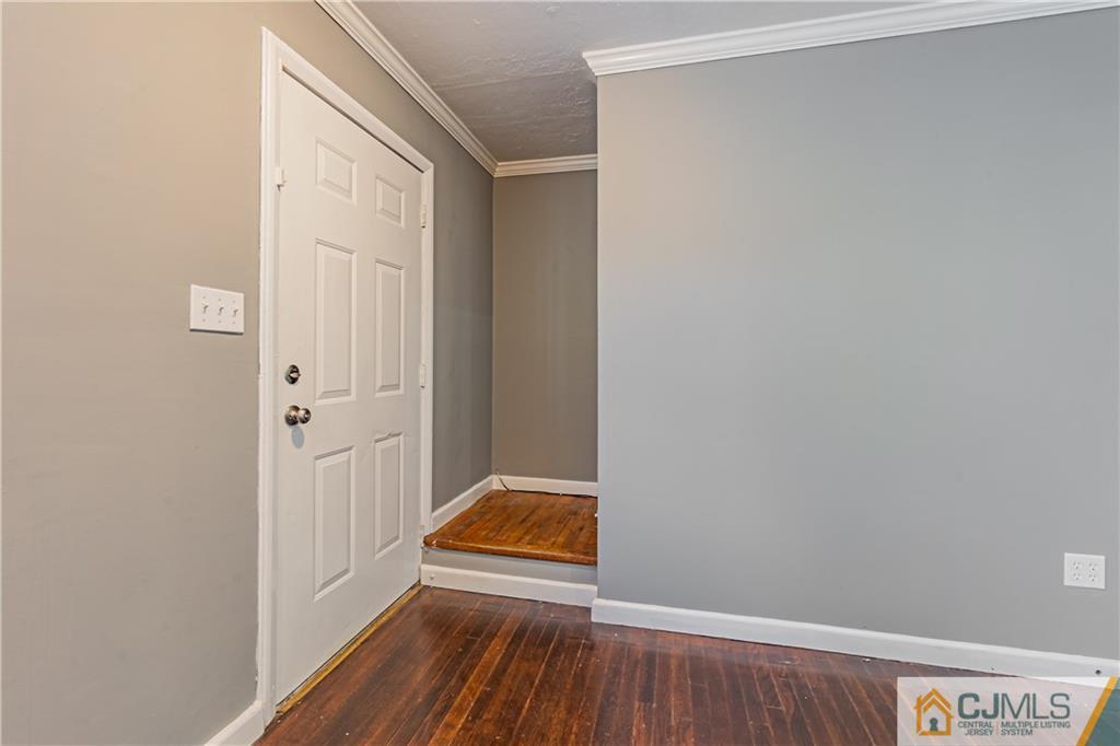 12 Jones Place Edison, NJ 08817 - Photo 10 of 28 a view of a room with wooden floor