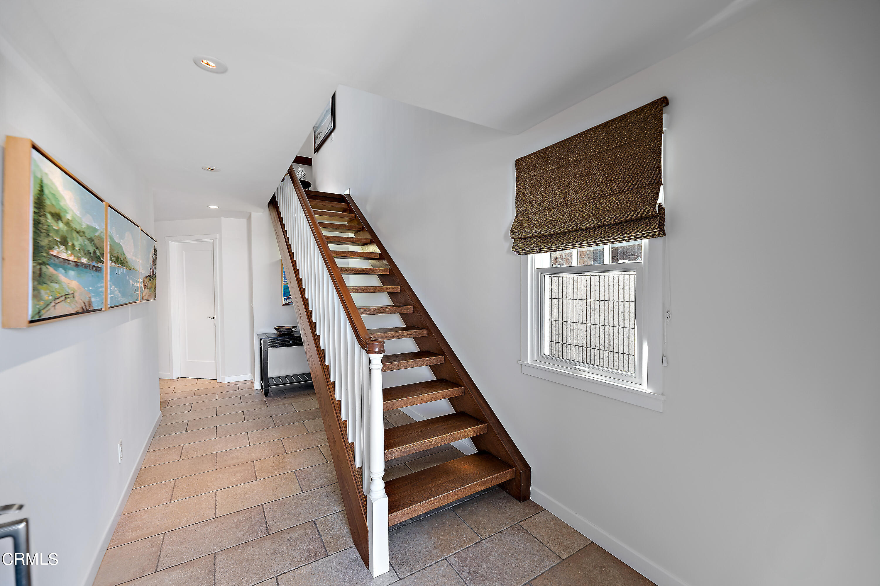 2013 Ocean Drive Oxnard, CA 93035 - Photo 16 of 60 a view of an entryway with stairs wooden floor and windows