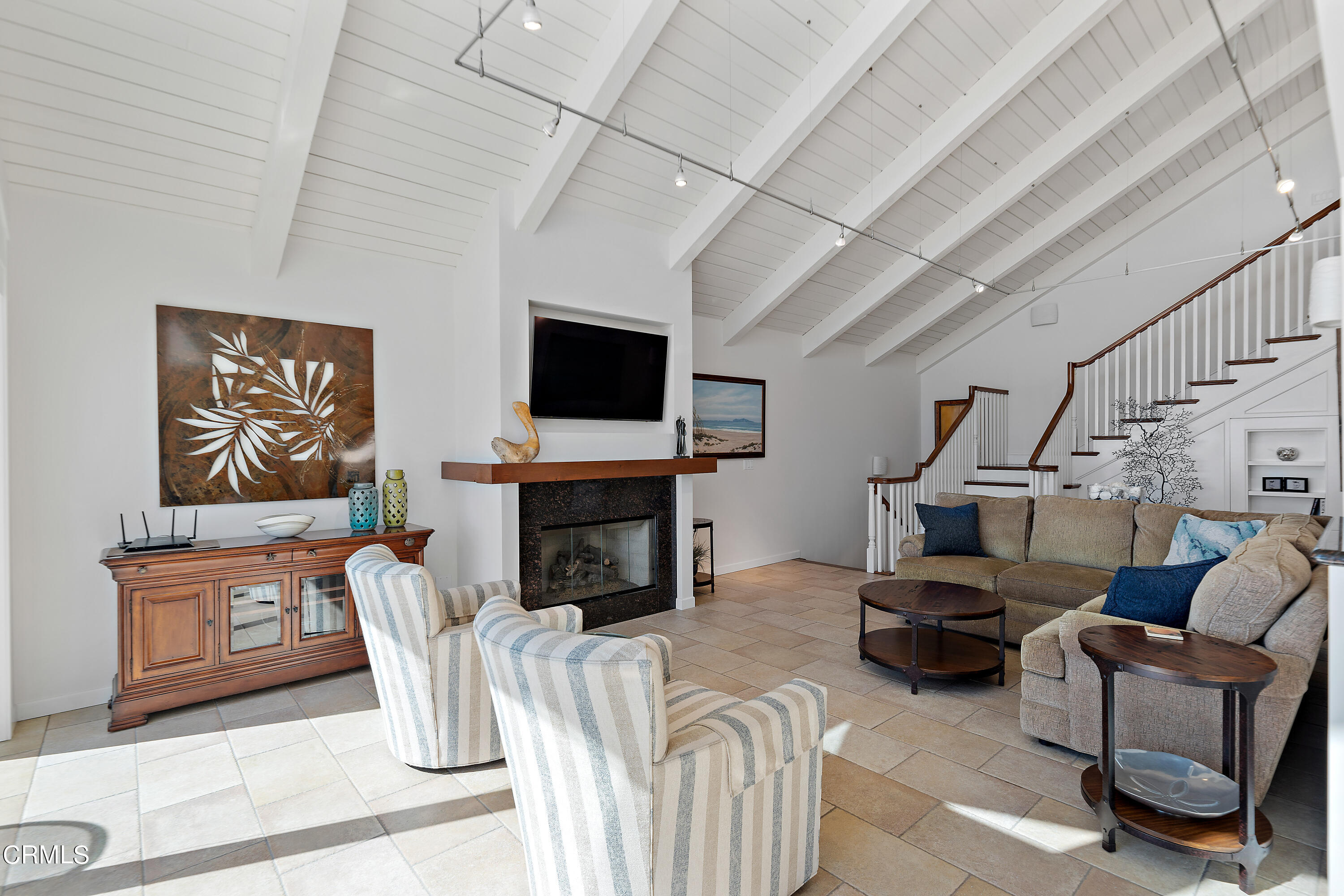 2013 Ocean Drive Oxnard, CA 93035 - Photo 22 of 60 a living room with furniture a fireplace and a flat screen tv