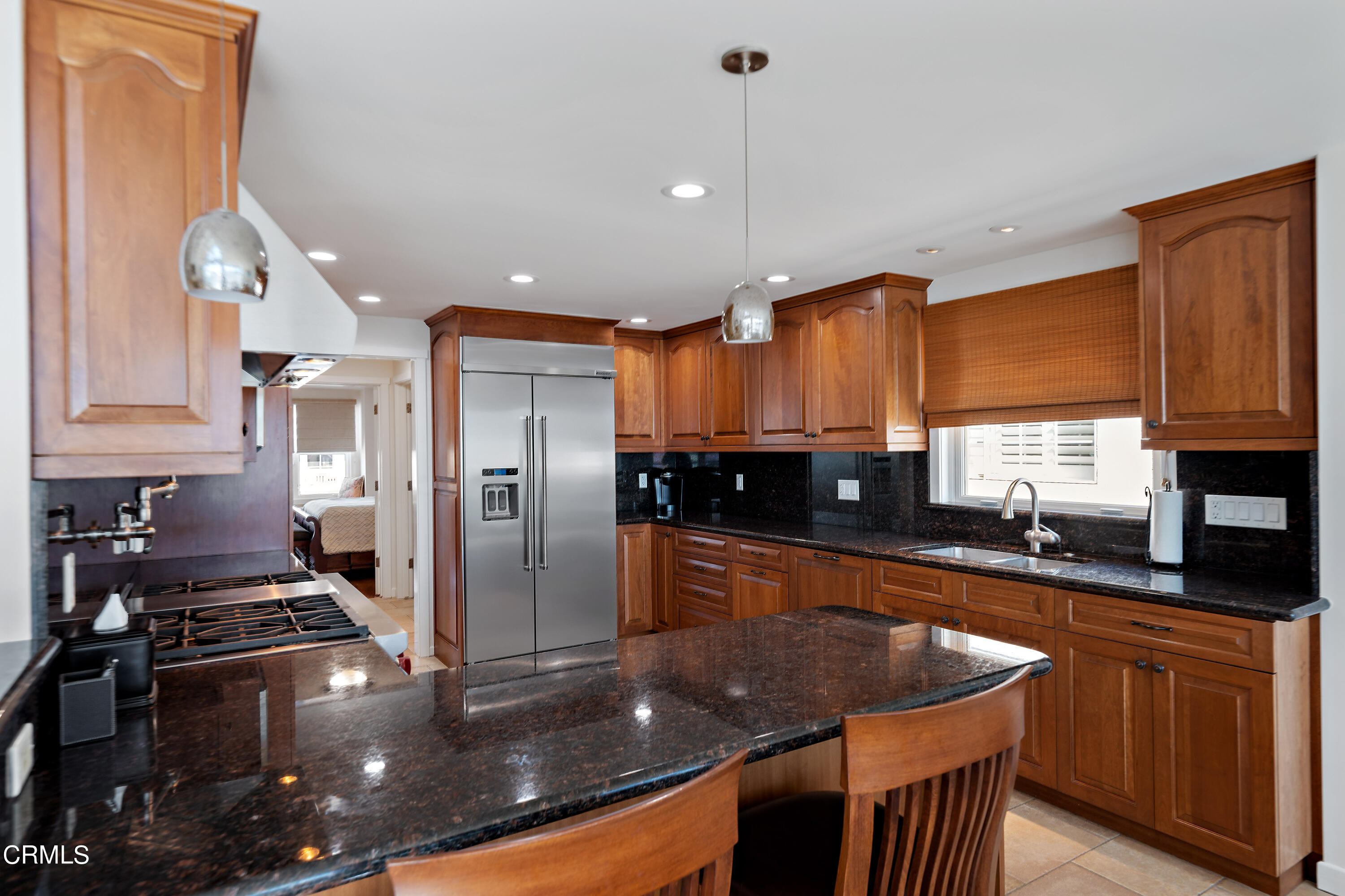 2013 Ocean Drive Oxnard, CA 93035 - Photo 29 of 60 a kitchen with stainless steel appliances granite countertop a sink a stove and a refrigerator