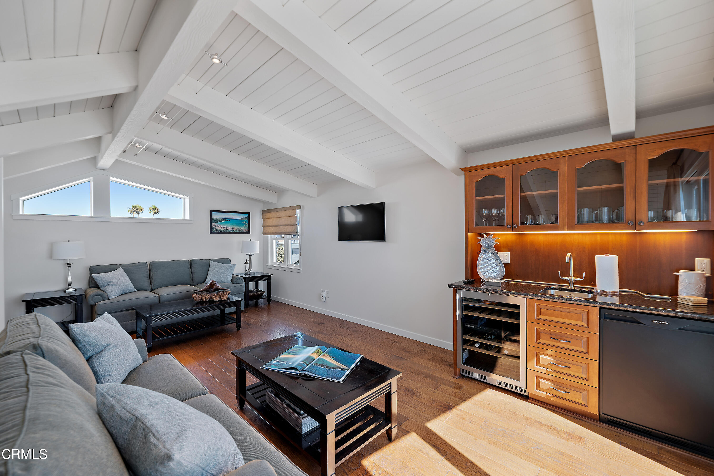2013 Ocean Drive Oxnard, CA 93035 - Photo 40 of 60 a living room with furniture a flat screen tv and kitchen view
