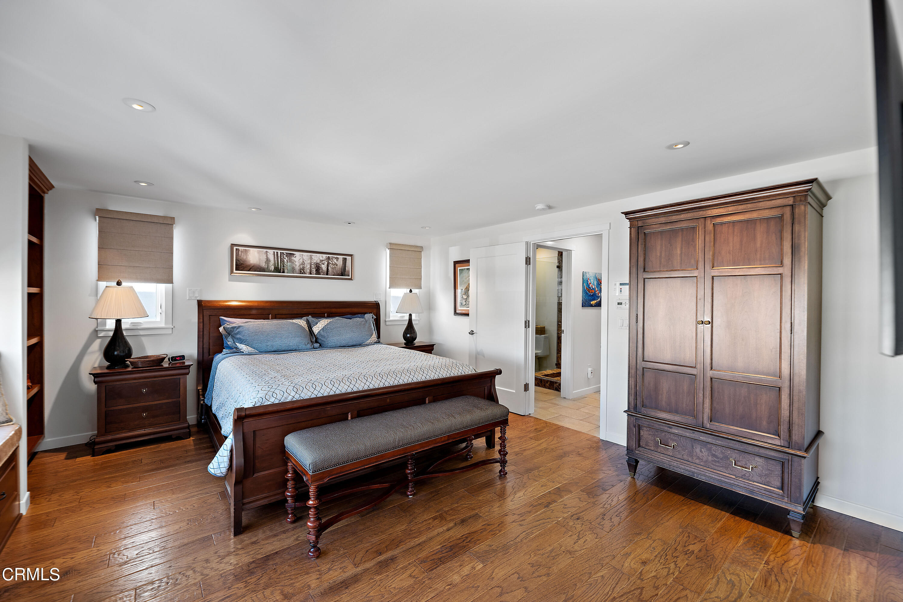 2013 Ocean Drive Oxnard, CA 93035 - Photo 45 of 60 a spacious bedroom with a bed and wooden floor