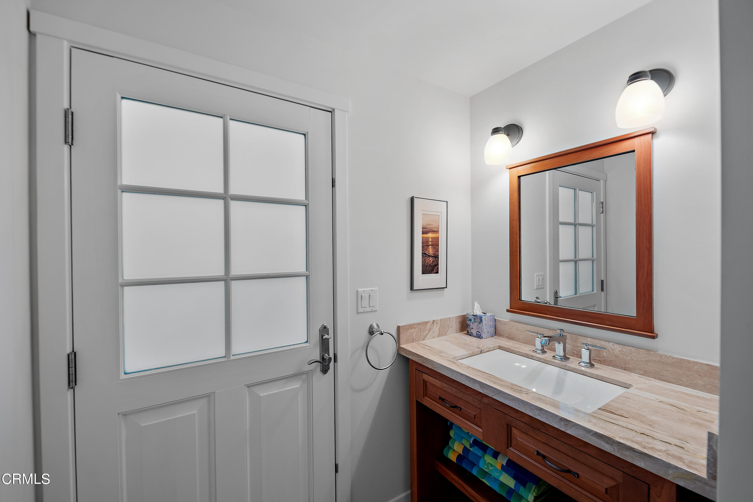 2013 Ocean Drive Oxnard, CA 93035 - Photo 56 of 60 a bathroom with a sink a vanity and a mirror