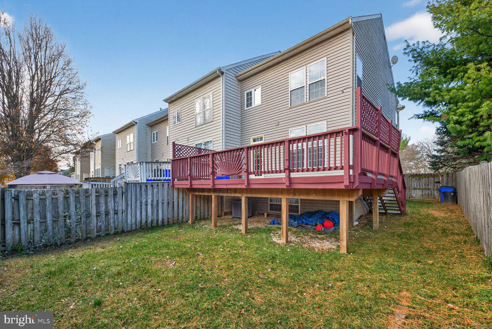 6715 Manorly Court Frederick, MD 21703 - Photo 15 of 15 a view of a house with a yard