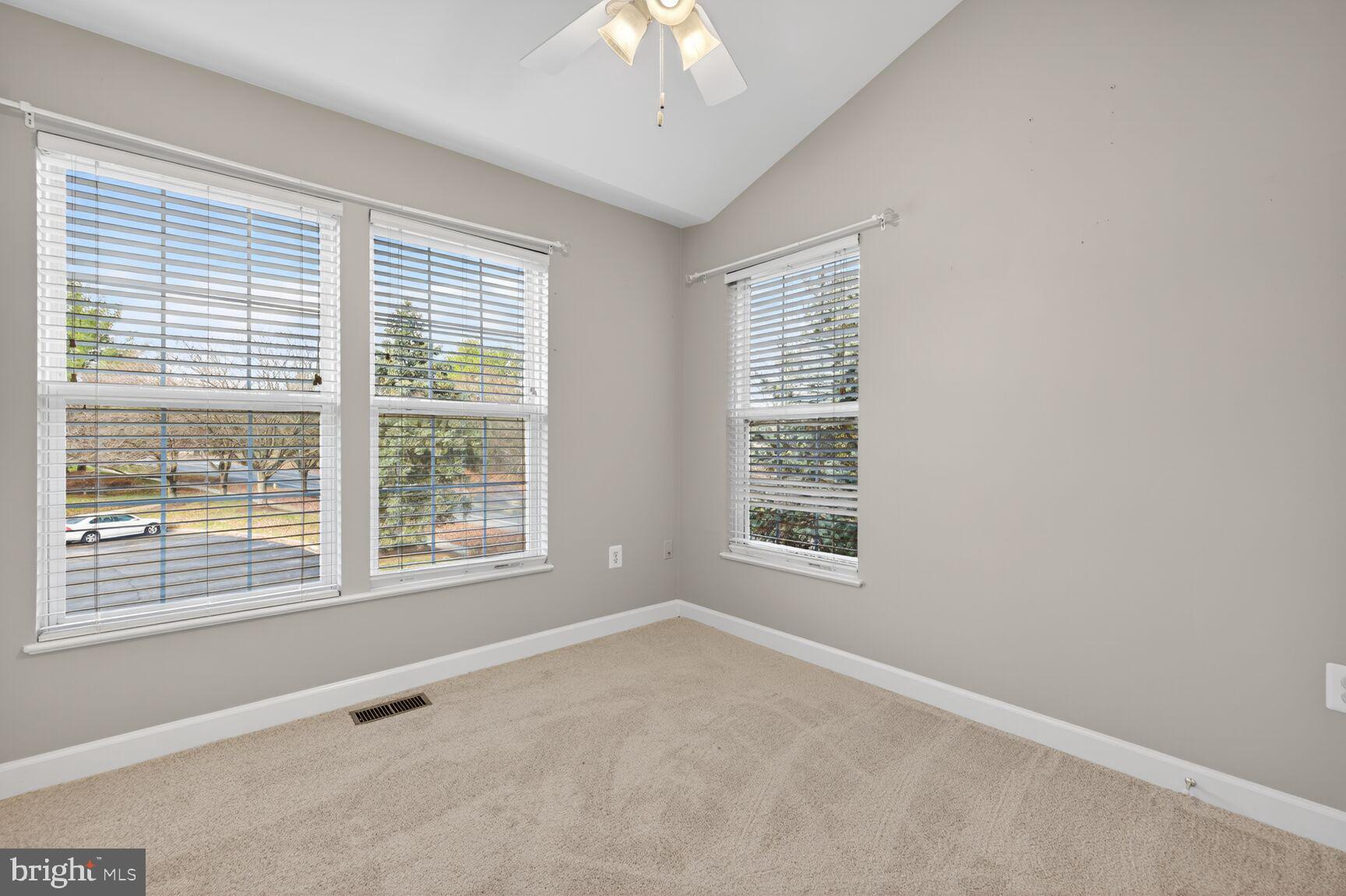 6715 Manorly Court Frederick, MD 21703 - Photo 6 of 15 a view of an empty room with a window