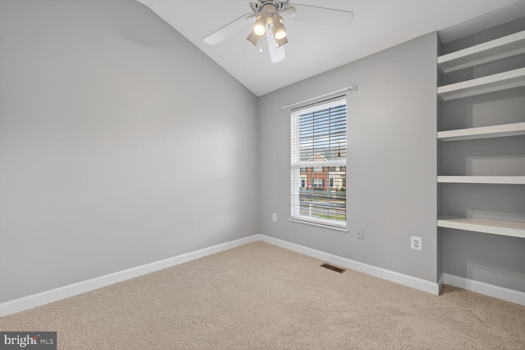 6715 Manorly Court Frederick, MD 21703 - Photo 7 of 15 a view of an empty room with a window