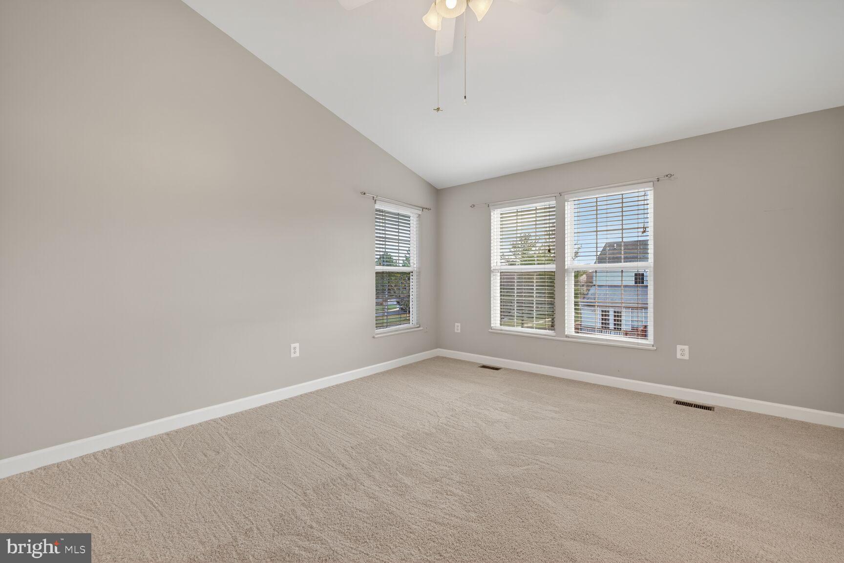 6715 Manorly Court Frederick, MD 21703 - Photo 8 of 15 a view of an empty room with a window
