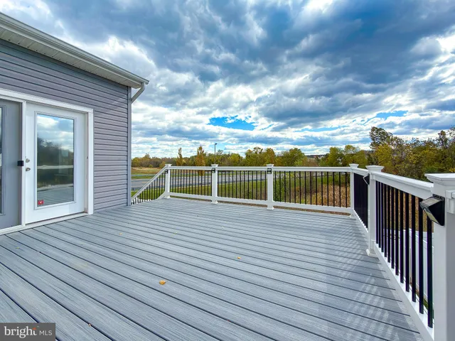 a kitchen with stainless steel appliances granite countertop wooden cabinets a sink and dishwasher