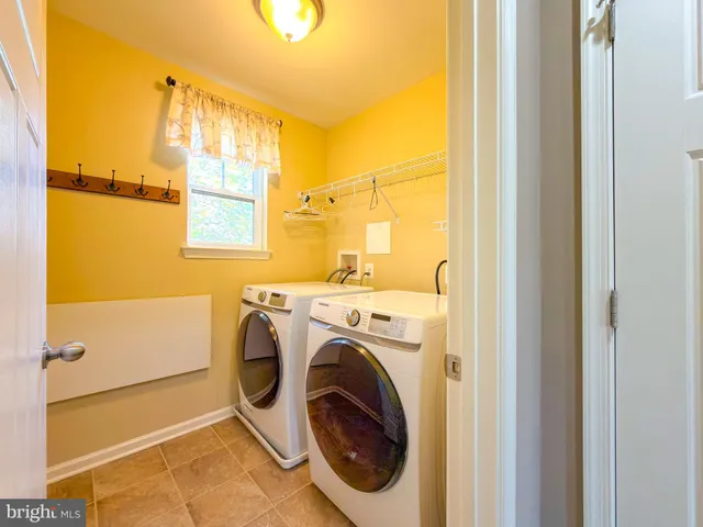 a view of a livingroom with a ceiling fan and a window