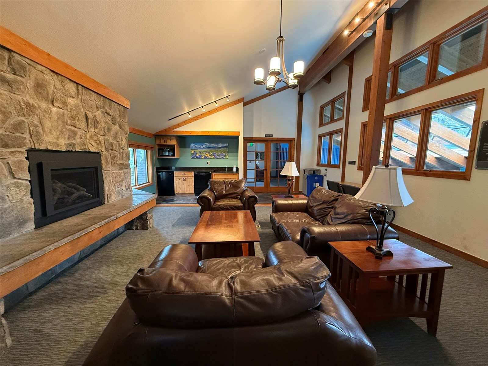 500 Bills Ranch Road, Unit C111 Frisco, CO 80443 - Photo 30 of 33 a living room with furniture a chandelier and a fireplace