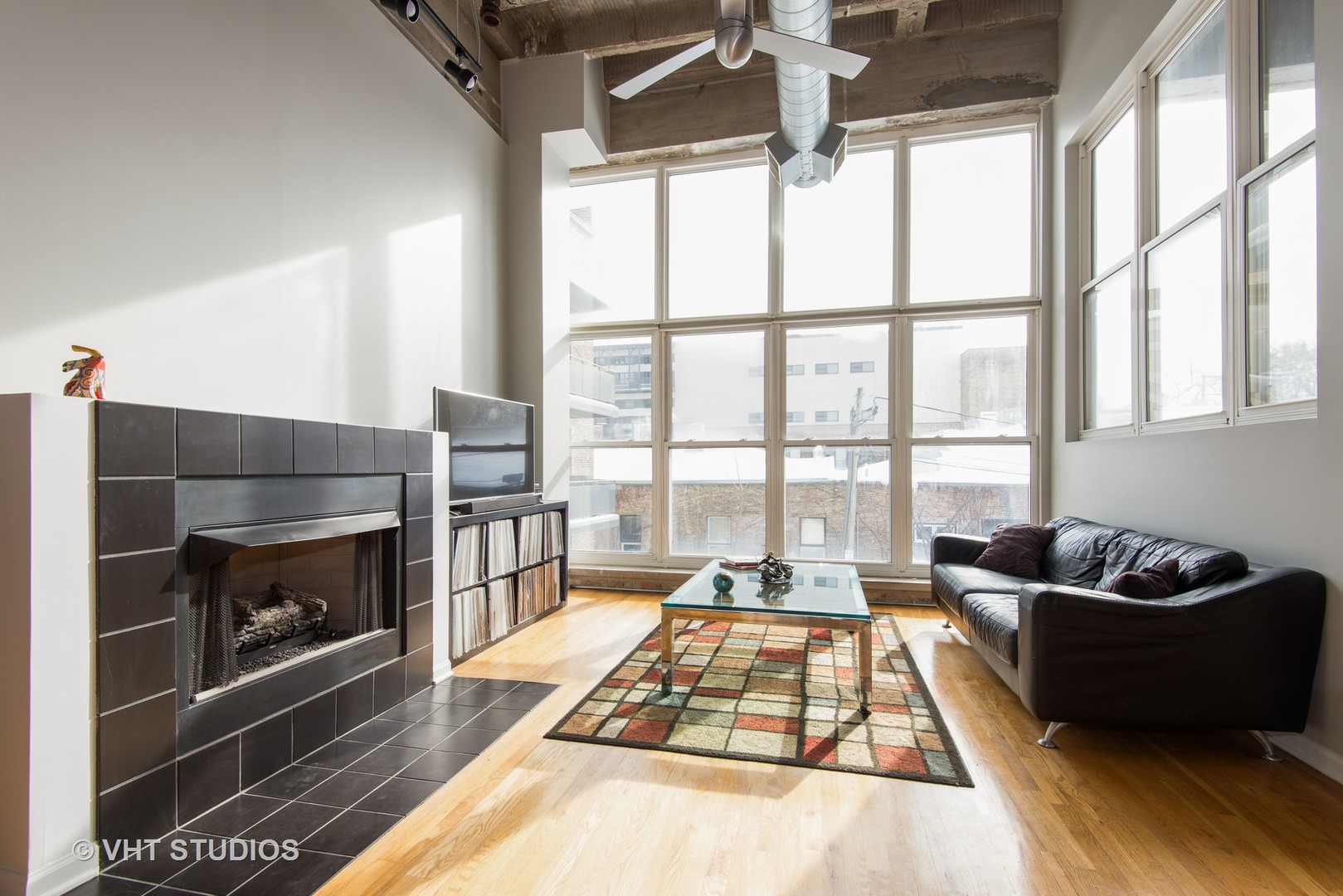 1834 Ridge Avenue, Unit 128 Evanston, IL 60201 - Photo 2 of 9 a living room with furniture fireplace and a large window