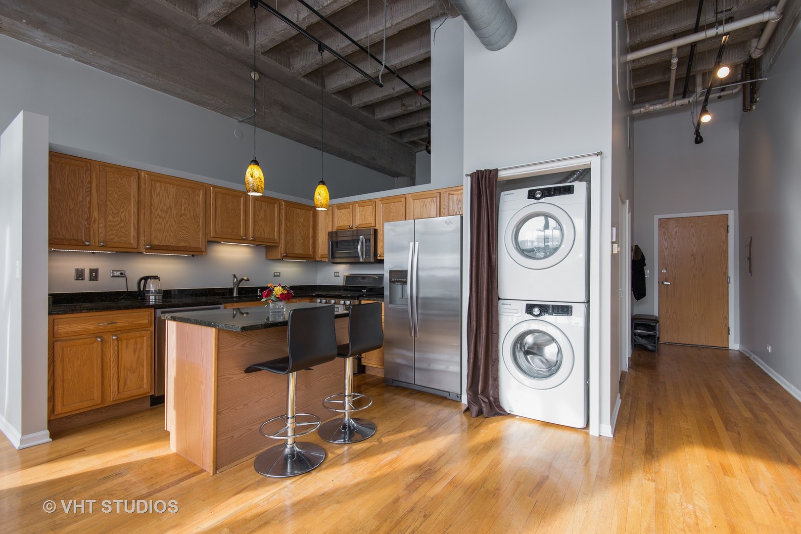 1834 Ridge Avenue, Unit 128 Evanston, IL 60201 - Photo 4 of 9 a kitchen with refrigerator and cabinets