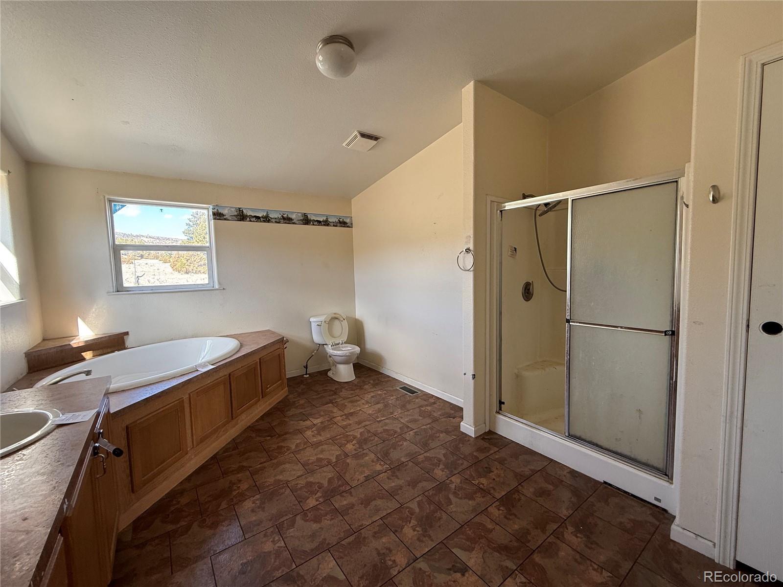 577 Fdr 101 Road Antonito, CO 81120 - Photo 32 of 40 a room with a bed and a window