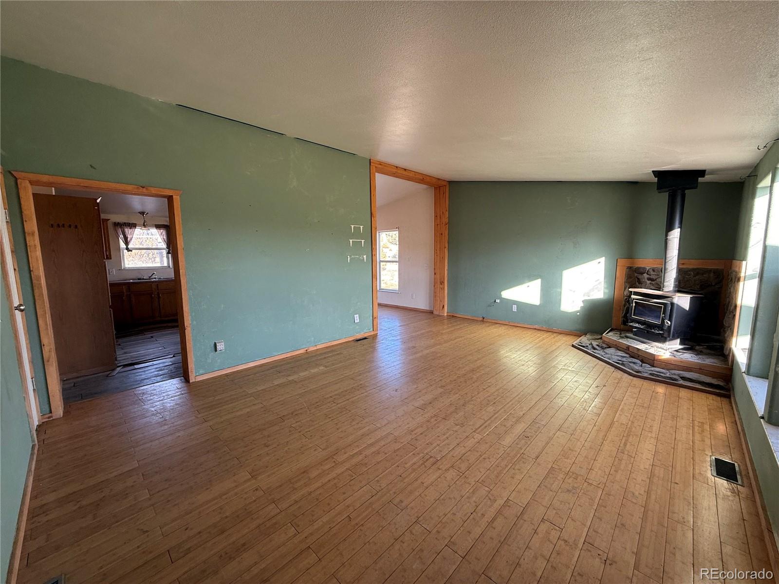577 Fdr 101 Road Antonito, CO 81120 - Photo 7 of 40 a view of a livingroom with wooden floor