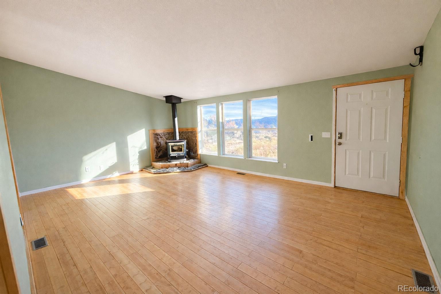 577 Fdr 101 Road Antonito, CO 81120 - Photo 8 of 40 a view of a livingroom with a furniture and wooden floor