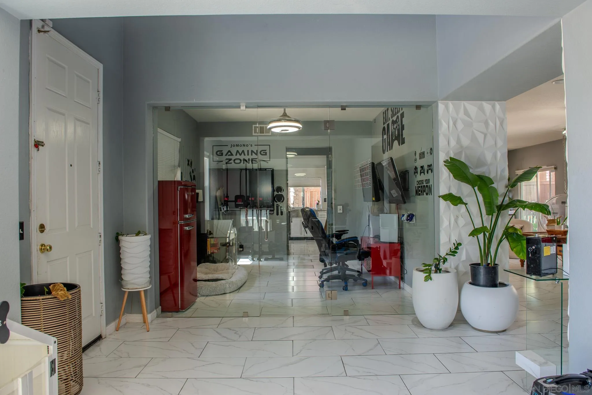 33567 Magnetite Street Menifee, CA 92584 - Photo 12 of 49 a hallway with a table and chairs