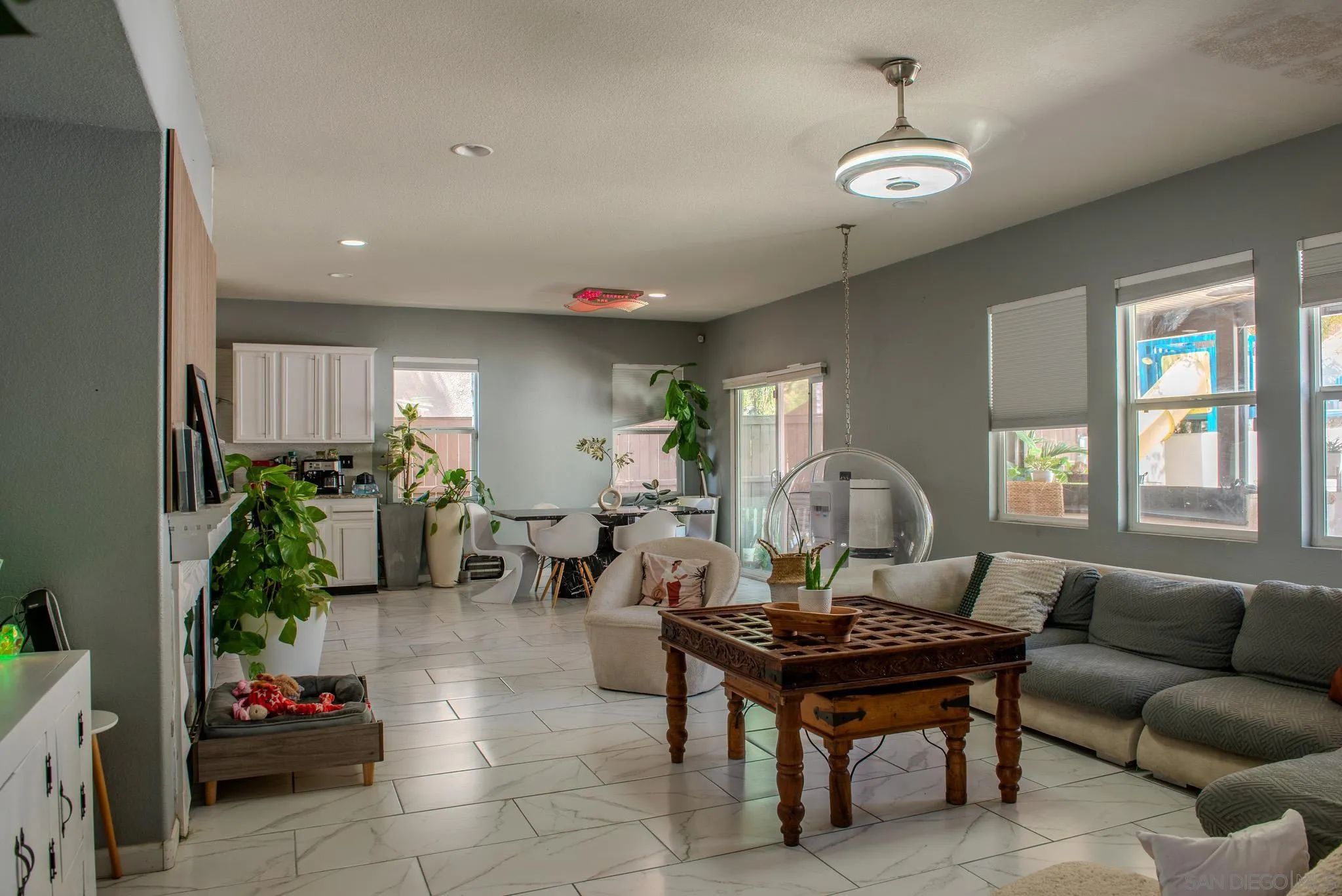 33567 Magnetite Street Menifee, CA 92584 - Photo 13 of 49 a living room with furniture and a potted plant