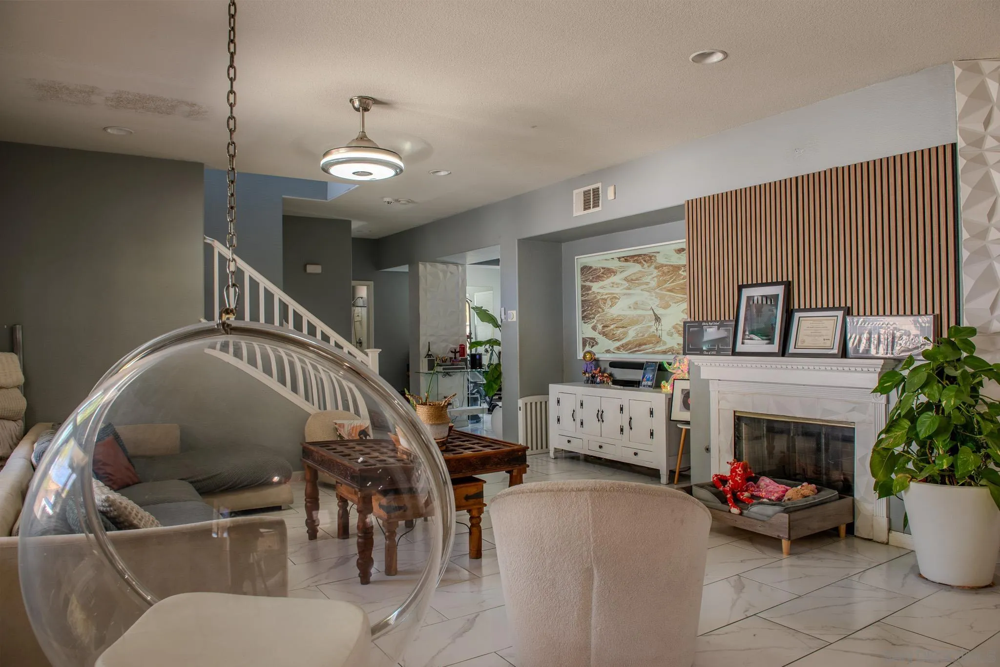 33567 Magnetite Street Menifee, CA 92584 - Photo 14 of 49 a living room with furniture a fireplace and a flat screen tv